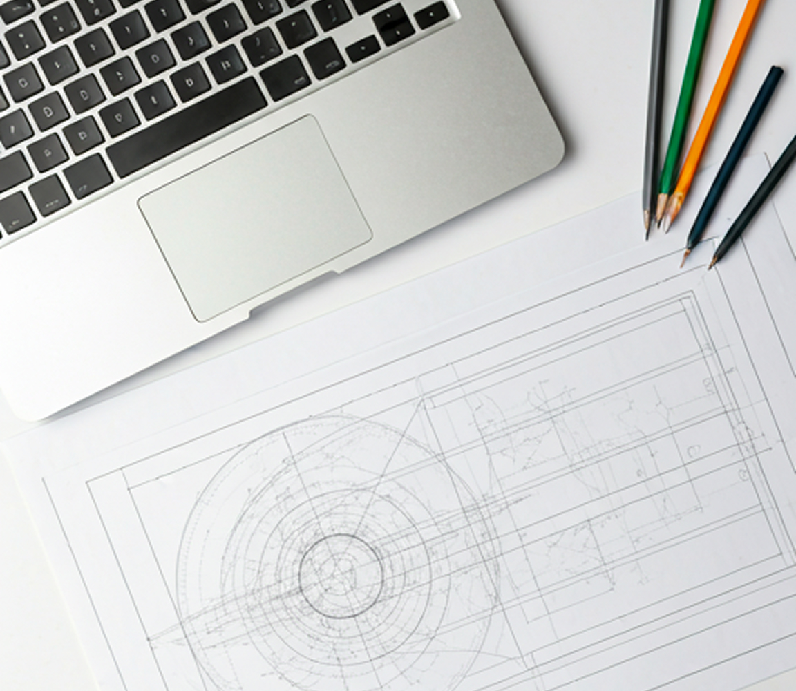 Architecture blueprint and laptop